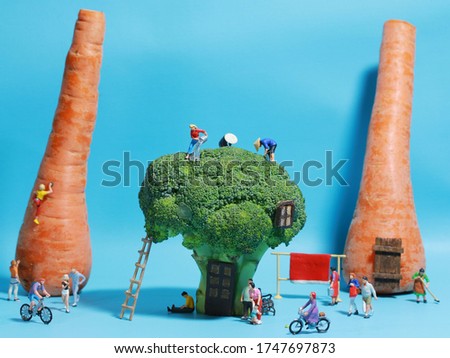 Miniature People doing activities on their vegetables neighborhood concept