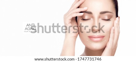 Anti aging treatment and plastic surgery concept. Beautiful serene woman with fresh clean skin. Heathy skin woman gracefully holding hands to her face. Cosmetology, beauty treatment and skincare. Royalty-Free Stock Photo #1747731746