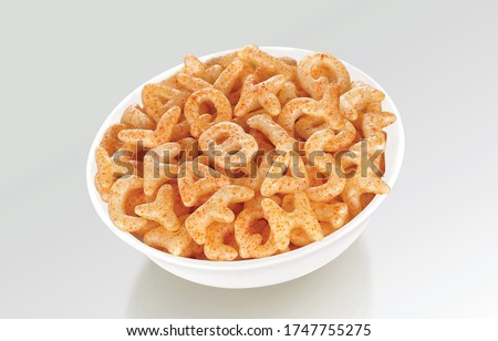 Fried and Spicy ABCD, Alphabet Snacks or Fryums (Snacks Pellets) served in a white bowl. selective focus - Image Royalty-Free Stock Photo #1747755275