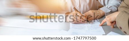 Business women's negotiating a contract. Panoramic business banner.