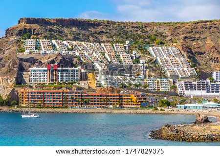 Cura beach (Spanish: Playa del Cura), rocky beach near Puerto Rico de Gran Canaria holiday resort on Gran Canaria island, Spain Royalty-Free Stock Photo #1747829375
