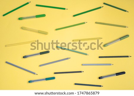 Stationery on yellow. Flat lay. Rows of tools, pastel gradient rainbow colors.
