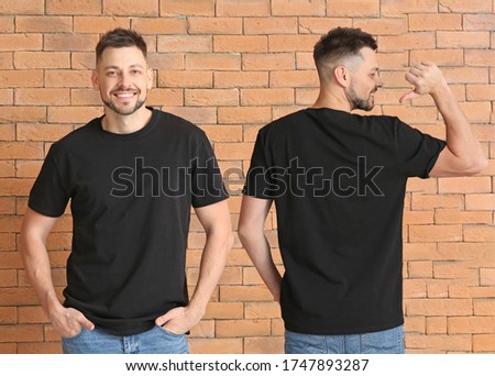 Man in stylish t-shirt near brick wall. Front and back view