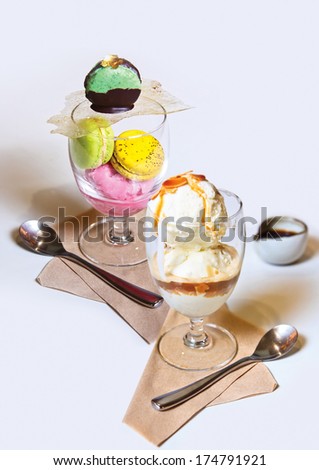 Colorful macaroons & ice cream, Colorful macaroons isolated on white background & scoops of ice cream with caramel sauce.