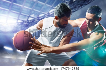 day light professional basketball players in the action