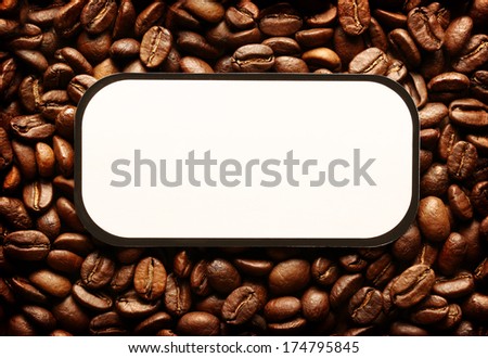 Brown coffee beans background with blank label