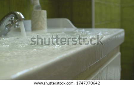 Overflowing water in the bathroom Royalty-Free Stock Photo #1747970642