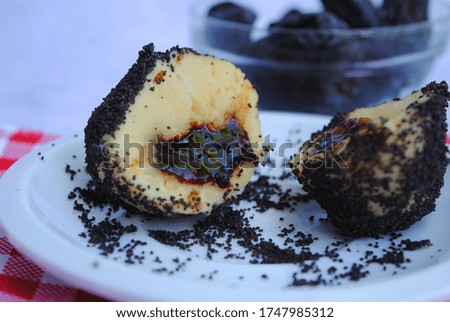 Close up view of Poppy Seed Potato Dumpling with Plum jam. 