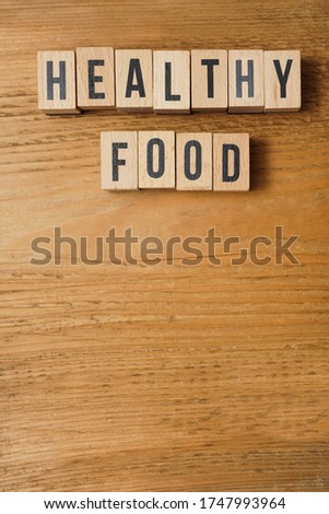 healthy Food the words on wooden blocks. Healthy or unhealthy food nutrition concept. empty copy space for inscription.
