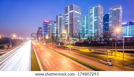 light trails on the modern city at dusk in beijing,China