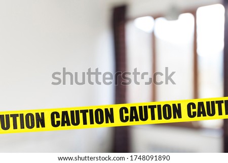 Interior of room with yellow tape, crime or quarantine zone, blur picture with place for text