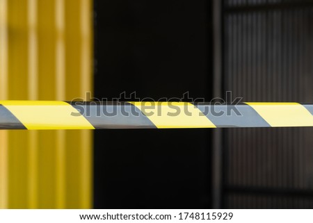 Black and yellow Barrier tape used for separating the boundary Restricted area for constructionBarrier tape is a device for displaying restricted areas. For some purpose Do not allow anyone to enter  Royalty-Free Stock Photo #1748115929