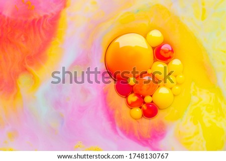 Multicolor abstract background made of liquid and oil. Transparent and color paints.