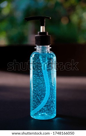 Close up of alcohol hand sanitizer gel in pump bottle on blurred background