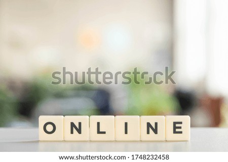 white blocks with online lettering on white desk in office