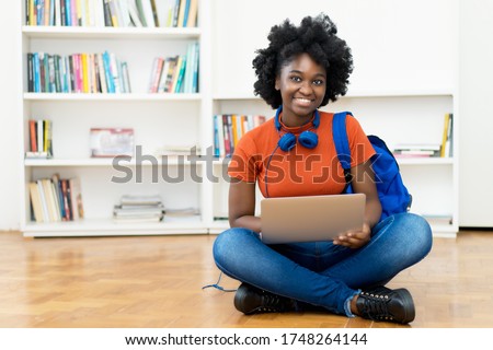 Video call of african american female student at computer with copy space indoors at home