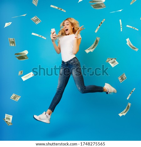 Online Lottery. Creatife Collage Of Overjoyed Woman Jumping With Smartphone Under Money Shower, Celebrating Victory, Full-Length Shot