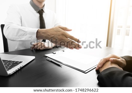 Closeup hand of interview employee is reach out one's hand for make handshake with jobseeker in the office, Job applications concepts. Royalty-Free Stock Photo #1748296622