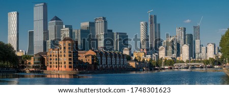 Panoramic view of the modern buildings in the Rotherhithe area over the Thames rives in Canary Wharf, London