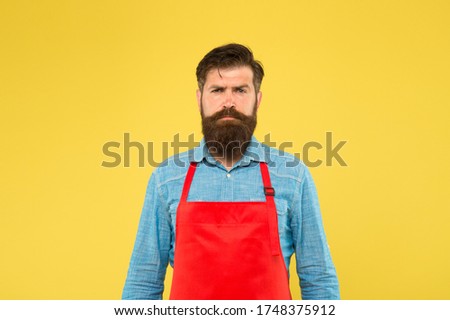 professional chef in red apron. restaurant staff wanted. cooking is his hobby. bearded man in cook uniform. confident male housekeeper. Small business shop owner. mature shop assistant.
