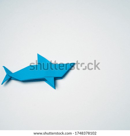 
image of a paper blue shark