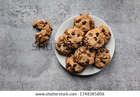 Plate of freshly baked chocolate chip cookies shot from above. Royalty-Free Stock Photo #1748385806