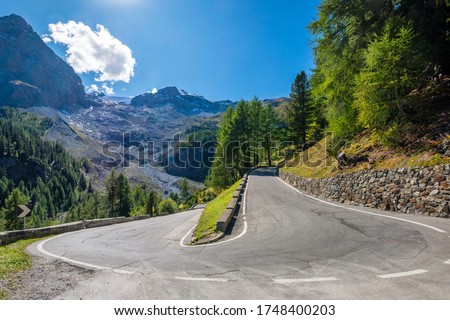 The Stelvio Pass is a mountain pass in the Ortler alps in South Tyrol (Northern Italy) and connects to the Swiss Umbrail pass towards the Val Müstair. It has a total of seventy-five hairpin turns Royalty-Free Stock Photo #1748400203