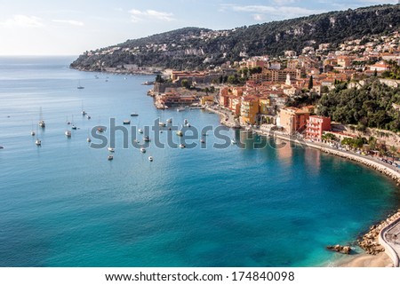 Beach of Eze sur mer in south of france with mountain in the background Royalty-Free Stock Photo #174840098