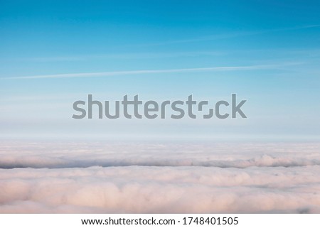bird eye view of cloud and sun ray light shot from airplane window 
