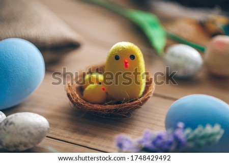 Decorative yellow felt chicken with nest
