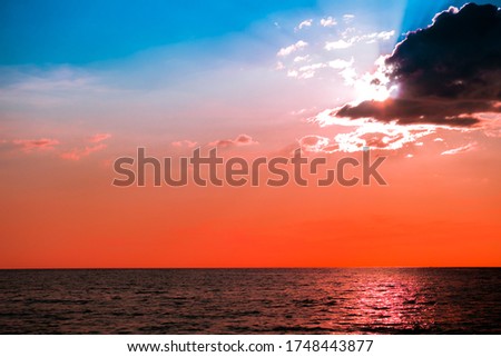 Beautiful sunset over the sea on the tropical beach with Orange color sky and clouds for travel in holiday relax time