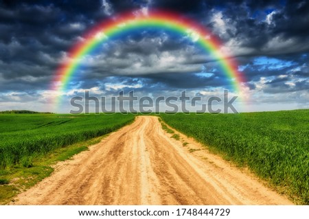 Scenic View Of Rainbow Over Road Against Sky