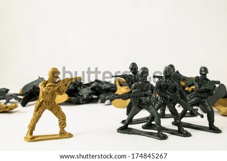 Plastic Lead Soldiers Representing War on a White Background Royalty-Free Stock Photo #174845267