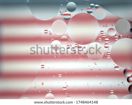 Closeup white -pink bubbles oil with colorful of American flag background ,macro image ,sweet color, blurred water droplets ,pastel shiny ball, drops wallpaper
