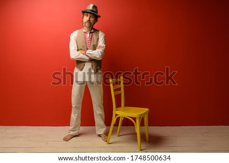 Studio portrait of adult man in artistic character