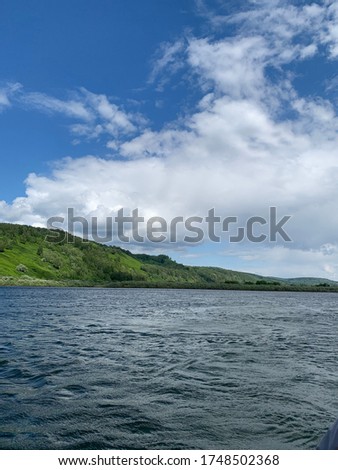 incredibly beautiful view of the river, mountains and sky, shot in daylight in spring in May, Russia - Kuzbass.  the background