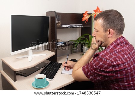 the man at the computer, heavy stress over finances