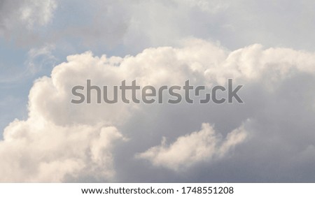Blue Sunny sky, white Cumulus clouds lower layer of cloud cover, sky background .