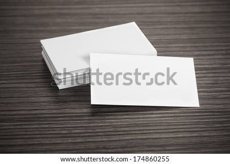 Blank corporate identity template package business cards on wood table.