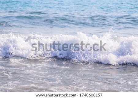 foaming waves in the sea. waves and foam.