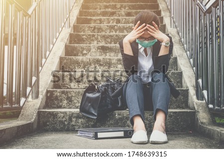 Portrait of unemployed businesswoman stressed after failure and laid off from work because impact from covid-19 pandemic outbreak. Conceptual of unemployed woman having negative feelings. Royalty-Free Stock Photo #1748639315