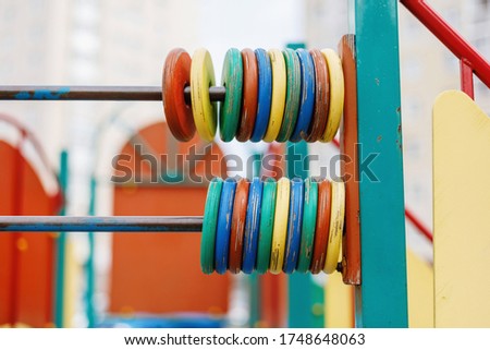 Children's playground with clolorful wooden rings game, closeup