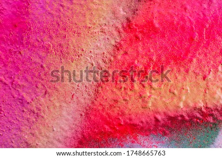 Beautiful bright colorful street art graffiti background. Abstract creative spray drawing fashion colors on the walls of the city. Urban Culture, orange , pink , purple , crimson, blue texture