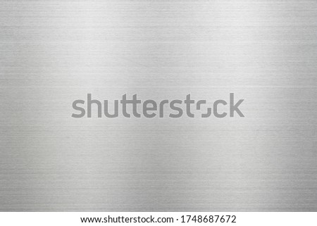 Abstract metal texture of brushed stainless steel plate with the reflection of light. Royalty-Free Stock Photo #1748687672
