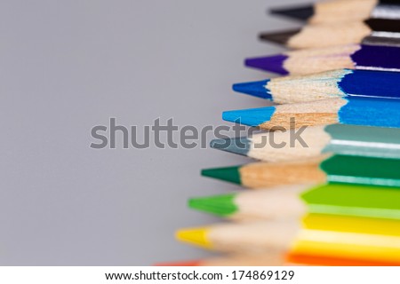 Brightly colored wooden pencils closeup shot background