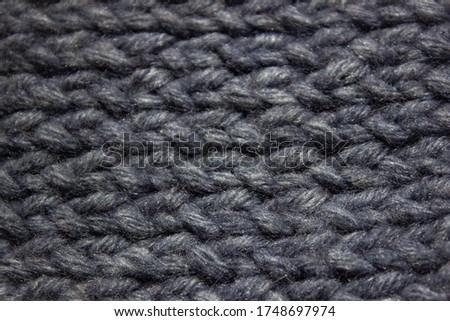 Grey and wool knitting texture of a warm sweater