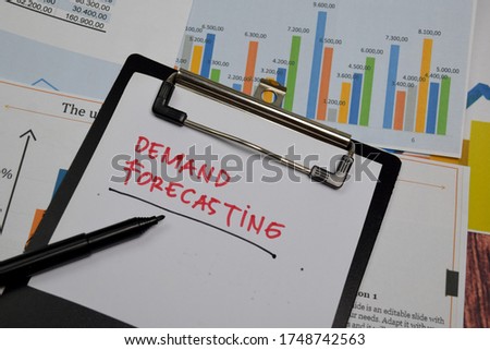 Demand Forecasting write on paperwork isolated on wooden table.