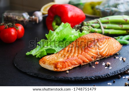 fried salmon barbecue grill Menu concept serving size. food background top view copy space for text keto or paleo pescatarian diet organic healthy eating Royalty-Free Stock Photo #1748751479