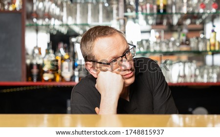 a pub host worries because of no guests in his pub