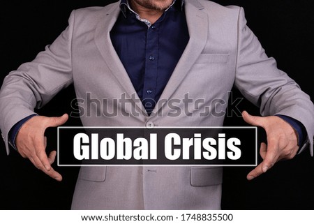 Global Crisis. Man holding an icon with a message text written on it.
